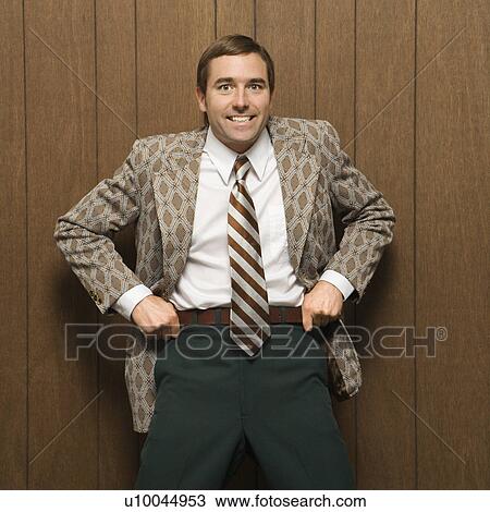 Mid-adult smiling Caucasian male in retro suit pulling up on pants. View Large Photo Image Stock Image - Mid-adult smiling Caucasian male in retro suit pulling up on pants.. Fotosearch