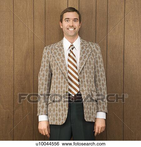 Stock Photograph - Portrait of smiling mid-adult Caucasian male in retro suit. Fotosearch