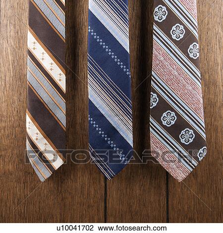 Three retro ties against wood paneling. View Large Photo Image Stock Image - Three retro ties against wood paneling.. Fotosearch