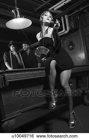 Caucasian prime adult female standing in front of pool table with two Caucasian prime adult men in background. View Large Photo Image Stock Photograph - Caucasian prime adult female standing in front of pool table with two Caucasian prime adult men in background.. Fotosearch