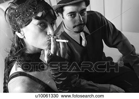 Stock Image - Caucasian prime adult male looking at Caucasian prime adult female looking at viewer.. Fotosearch