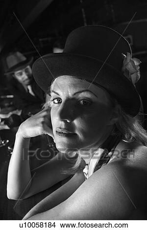 Picture - Caucasian prime adult retro female sitting at bar looking at viewer.. Fotosearch
