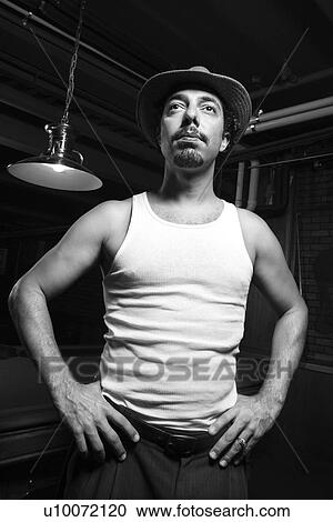 Caucasian prime adult retro male standing with hands on hips in front of pool table. View Large Photo Image Stock Image - Caucasian prime adult retro male standing with hands on hips in front of pool table.. Fotosearch