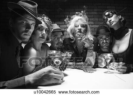 Group of Caucasian prime adult retro males and females sitting at table in lounge looking at viewer. View Large Photo Image Stock Photography - Group of Caucasian prime adult retro males and females sitting at table in lounge looking at viewer.. Fotosearch