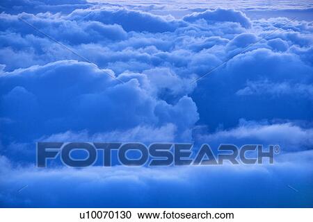 Stock Image - Aerial of blue clouds in Haleakala National Park, Maui, Hawaii.. Fotosearch
