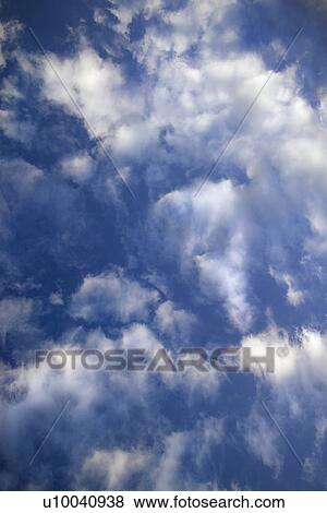 Stock Photo - Blue sky and clouds over Maui, Hawaii, USA.. Fotosearch