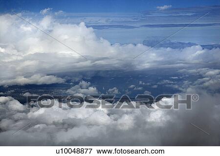 Stock Photo - Blue sky and clouds over Maui, Hawaii, USA.. Fotosearch