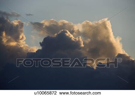 Stock Image - Cumulus clouds in sky.. Fotosearch
