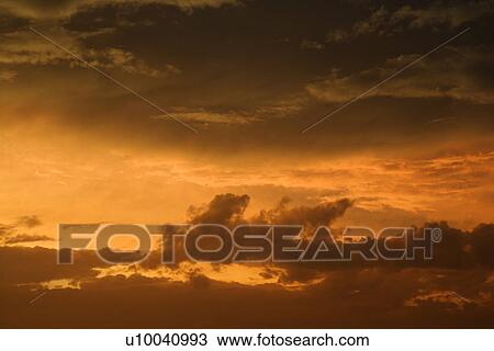 Golden yellow and orange sunset sky and clouds. View Large Photo Image Stock Image - Golden yellow and orange sunset sky and clouds.. Fotosearch