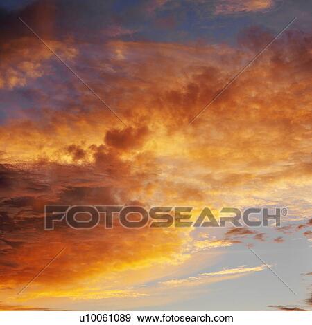 Orange clouds in sky with sunset. View Large Photo Image Stock Photo - Orange clouds in sky with sunset.. Fotosearch
