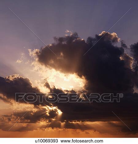 Sun shining through dark cloud. View Large Photo Image Stock Image - Sun shining through dark cloud.. Fotosearch