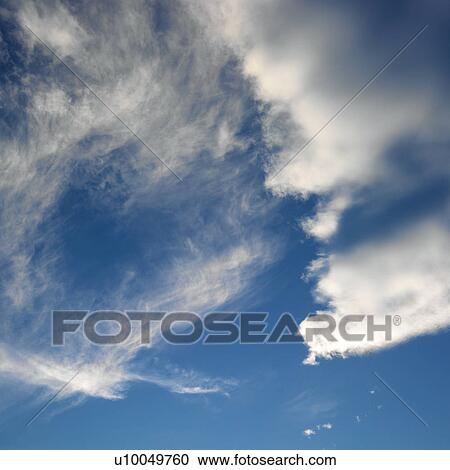 Wispy cloud formations against clear blue sky. View Large Photo Image Stock Image - Wispy cloud formations against clear blue sky.. Fotosearch