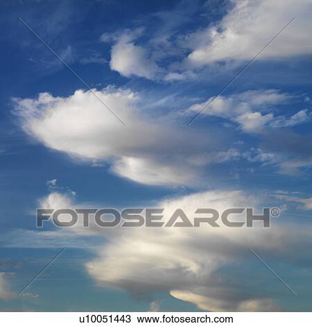 Wispy cloud formations against clear blue sky. View Large Photo Image Stock Image - Wispy cloud formations against clear blue sky.. Fotosearch
