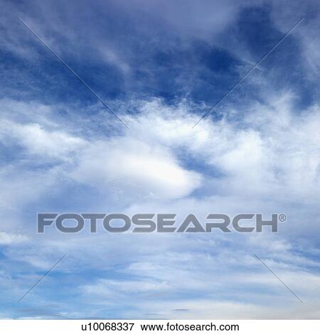 Wispy cloud formations against clear blue sky. View Large Photo Image Stock Photo - Wispy cloud formations against clear blue sky.. Fotosearch