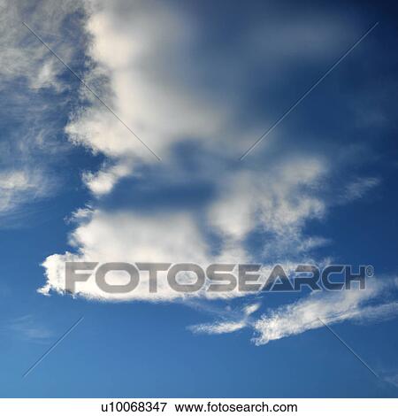 Wispy cloud formations against clear blue sky. View Large Photo Image Stock Photo - Wispy cloud formations against clear blue sky.. Fotosearch
