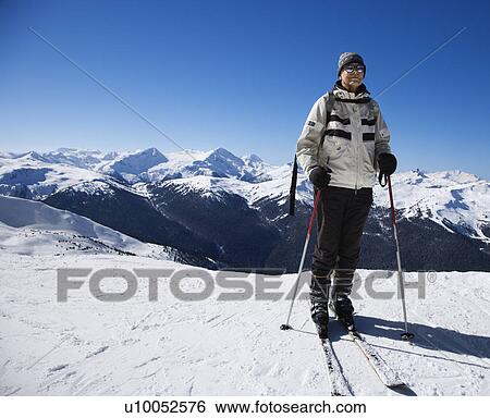 Stock Photograph - Caucasian senior man skier on slopes.. Fotosearch