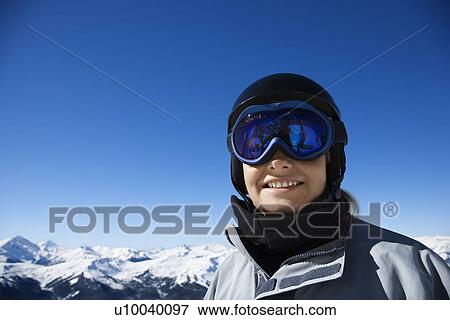 Caucasian teenage boy snowboarder wearing helmet and goggles on mountain looking at viewer. View Large Photo Image Stock Photo - Caucasian teenage boy snowboarder wearing helmet and goggles on mountain looking at viewer.. Fotosearch
