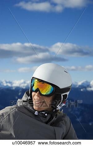 Caucasian teenage boy snowboarder wearing helmet and goggles on mountain. View Large Photo Image Stock Photo - Caucasian teenage boy snowboarder wearing helmet and goggles on mountain.. Fotosearch