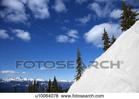 Scenic of snow-covered mountain side. View Large Photo Image Stock Photo - Scenic of snow-covered mountain side.. Fotosearch