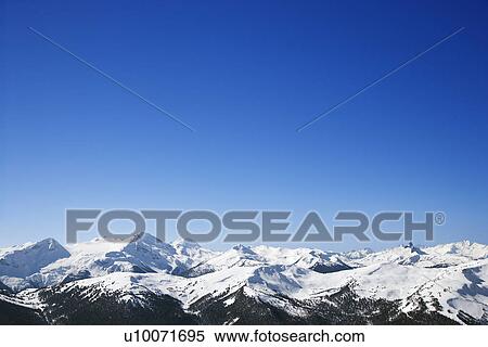 Stock Photography - Scenic snow-covered mountains. . Fotosearch