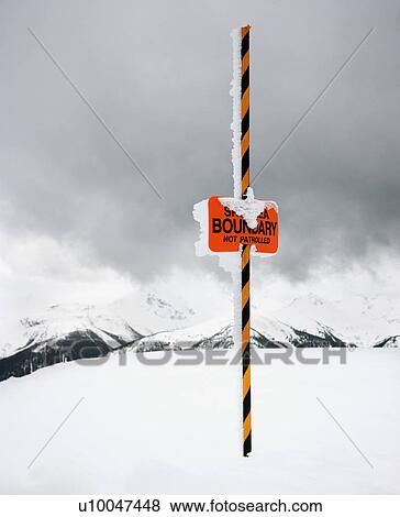 Ski area trail boundary sign in snow-covered mountain scene. View Large Photo Image Stock Photo - Ski area trail boundary sign in snow-covered mountain scene.. Fotosearch