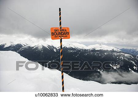 Ski area trail boundary sign with mountain landscape in background. View Large Photo Image Stock Image - Ski area trail boundary sign with mountain landscape in background.. Fotosearch