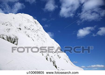 Snow-covered mountainside. View Large Photo Image Stock Photography - Snow-covered mountainside.. Fotosearch