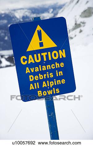 Stock Image - Snow ski resort caution sign on mountain side.. Fotosearch