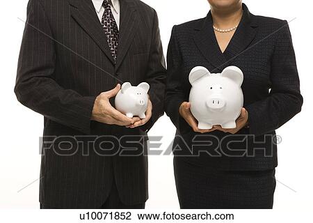Caucasian middle-aged businessman and Filipino businesswoman holding different sized piggybanks. View Large Photo Image Stock Image - Caucasian middle-aged businessman and Filipino businesswoman holding different sized piggybanks.. Fotosearch