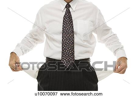 Stock Photo - Caucasian middle-aged businessman pulling empty pockets out standing against white background.. Fotosearch