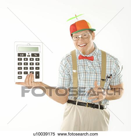 Caucasian young man dressed like nerd wearing beanie holding large calculator. View Large Photo Image Stock Photography - Caucasian young man dressed like nerd wearing beanie holding large calculator.. Fotosearch