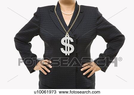 Stock Image - Close-up of Filipino middle-aged businesswoman wearing chain necklace with oversized dollar sign.. Fotosearch