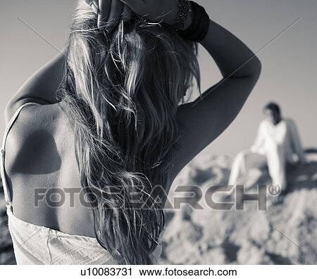 Stock Image - Couple on beach. Fotosearch