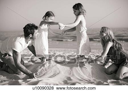 Family on the beach View Large Photo Image Stock Photo - Family on the beach. Fotosearch
