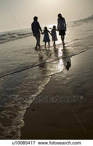 Family walking on beach View Large Photo Image Stock Photo - Family walking on beach. Fotosearch
