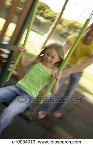 Father and daughter in park on swing View Large Photo Image Stock Image - Father and daughter in park on swing. Fotosearch