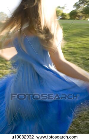 Girl in blue dress View Large Photo Image Stock Image - Girl in blue dress. Fotosearch