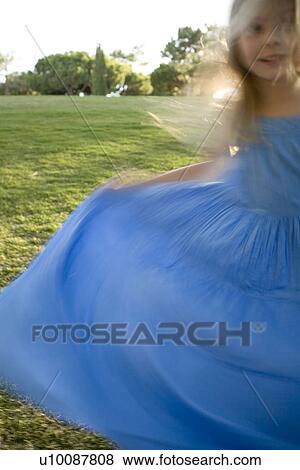 Girl in blue dress View Large Photo Image Stock Photo - Girl in blue dress. Fotosearch