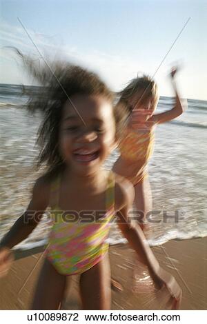 Girls running on the beach View Large Photo Image Stock Image - Girls running on the beach. Fotosearch