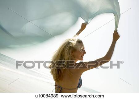 Woman on beach with shawl View Large Photo Image Stock Photo - Woman on beach with shawl. Fotosearch
