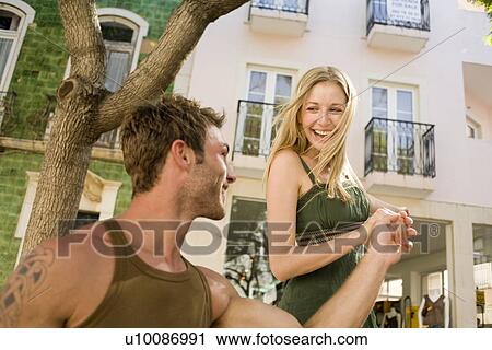 Stock Image - Couple in town. Fotosearch