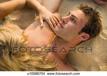Picture - Couple on beach. Fotosearch