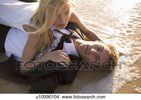 Picture - Couple on beach. Fotosearch