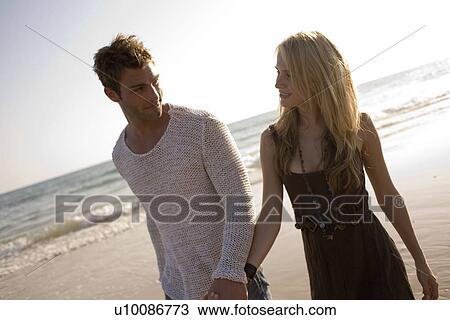 Couple on beach View Large Photo Image Stock Image - Couple on beach . Fotosearch