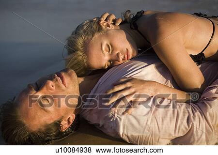 Couple on beach View Large Photo Image Stock Photo - Couple on beach. Fotosearch