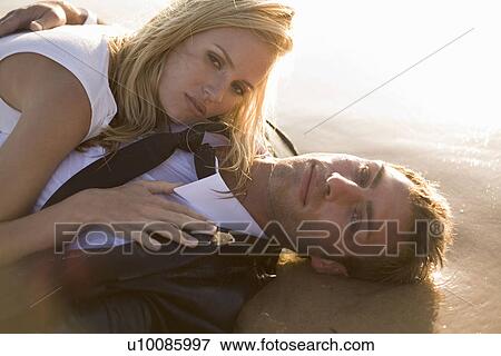 Couple on beach View Large Photo Image Stock Photo - Couple on beach. Fotosearch