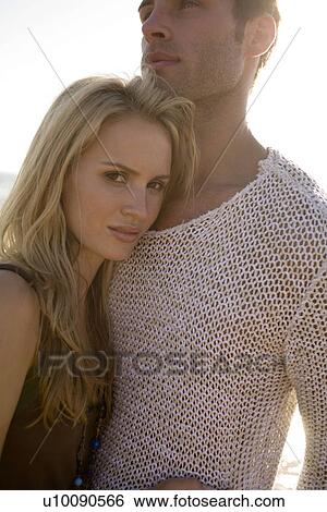 Stock Photograph - Couple on beach . Fotosearch