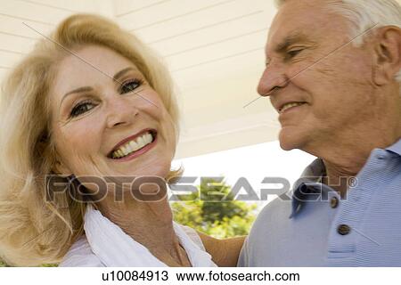 Stock Image - Mature couple in park. Fotosearch