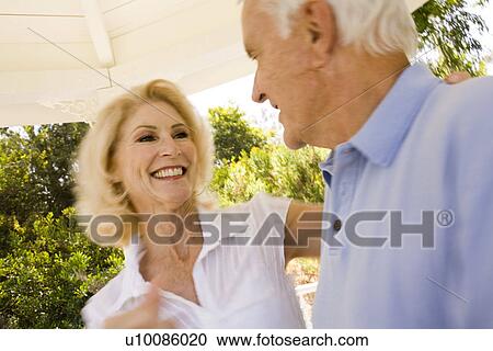 Mature couple in park View Large Photo Image Stock Image - Mature couple in park. Fotosearch