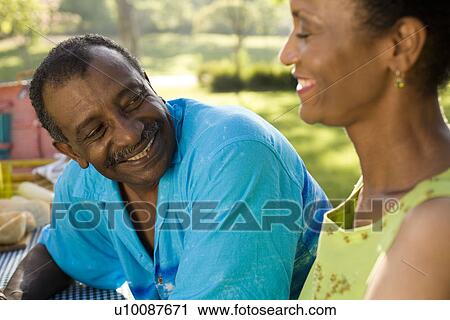 Mature couple in park View Large Photo Image Stock Image - Mature couple in park. Fotosearch